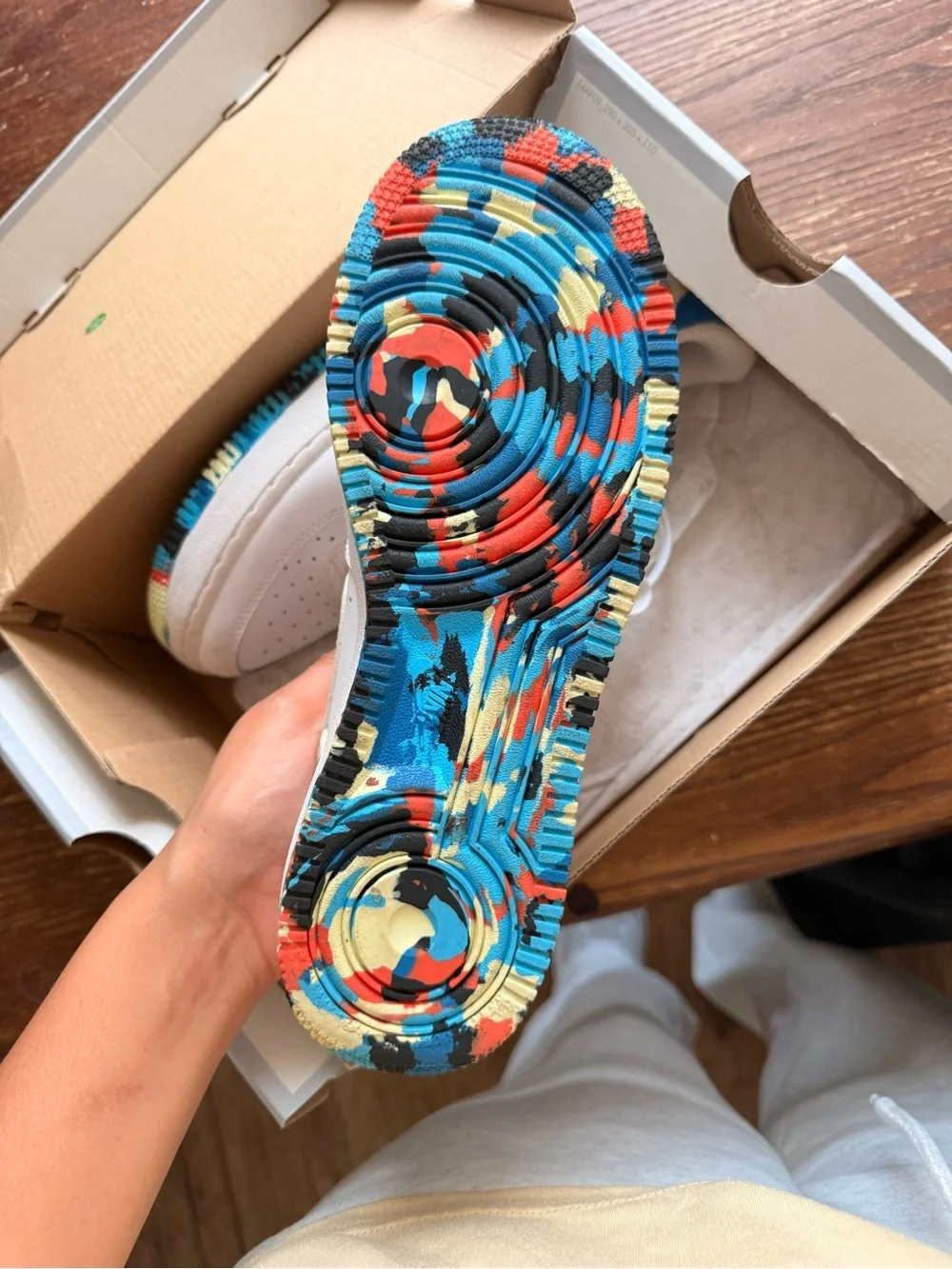 White Nike Low-Top Sneakers with Multicolor Accent
